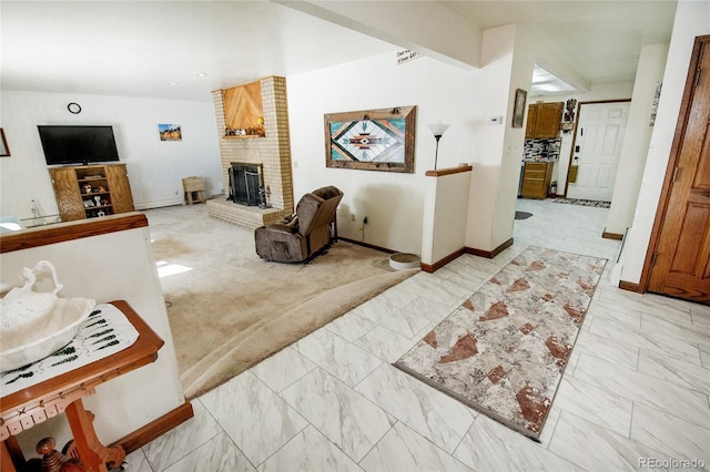 living room with a brick fireplace