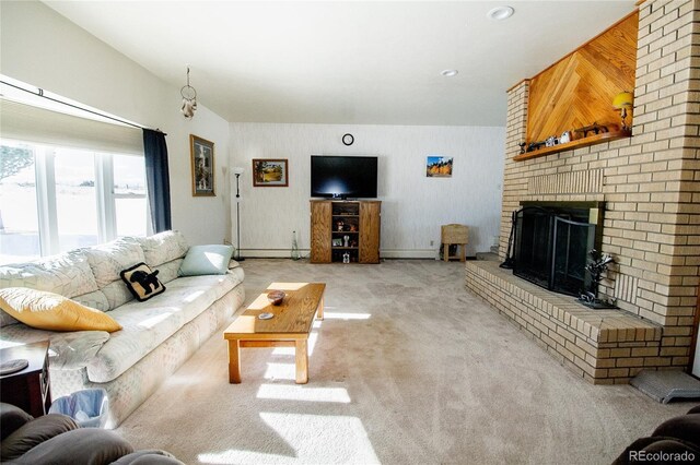 carpeted living room featuring a baseboard heating unit, a fireplace, and wooden walls