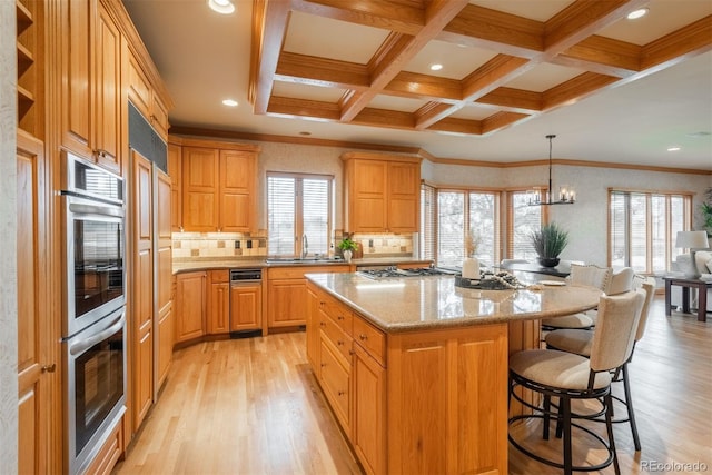 101 Glenmoor Ln, Cherry Hills Village, CO 80113 - kitchen with light wood finished floors, beamed ceiling, appliances with stainless steel finishes, a kitchen island, and coffered ceiling