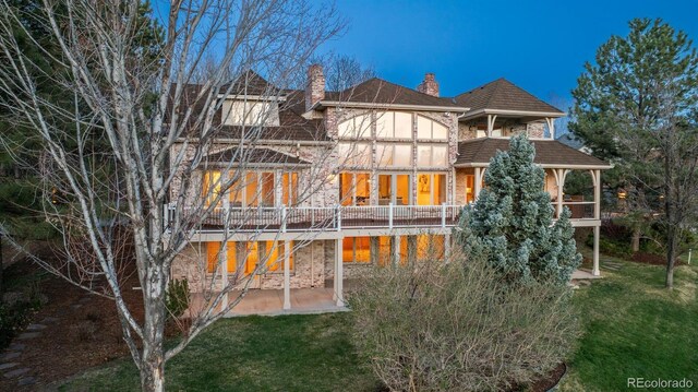 101 Glenmoor Ln, Cherry Hills Village, CO 80113 - back of house featuring a chimney, a patio, and a yard