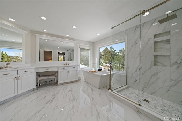 bathroom with marble finish floor, recessed lighting, a marble finish shower, a soaking tub, and vanity