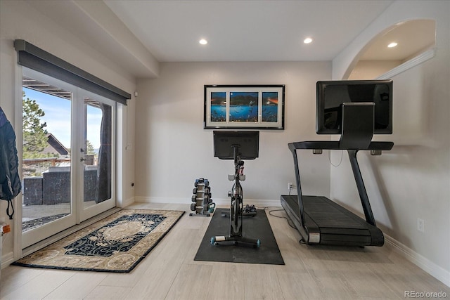 exercise area with recessed lighting, french doors, baseboards, and wood finished floors