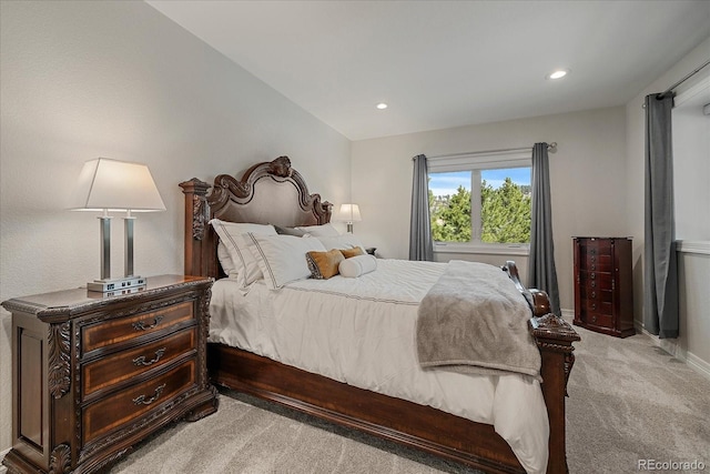 bedroom with recessed lighting, baseboards, and light carpet