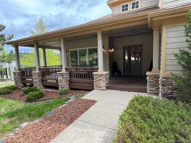1366 Killington Ct, Evergreen, CO 80439 - property entrance featuring a porch and roof with shingles