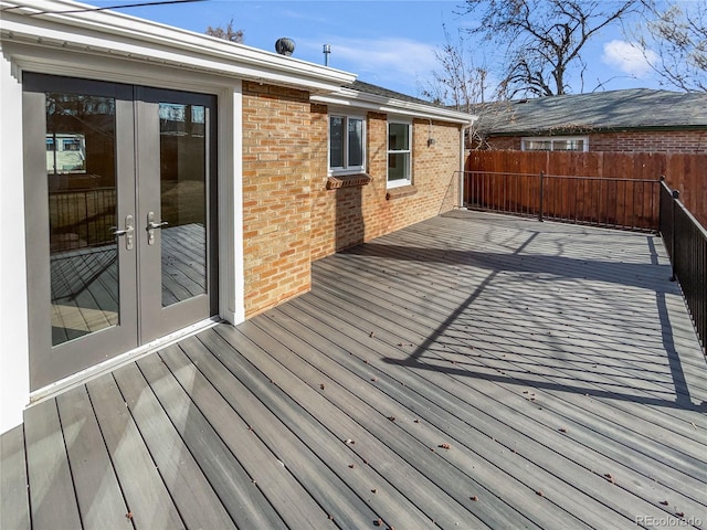 deck featuring french doors and fence