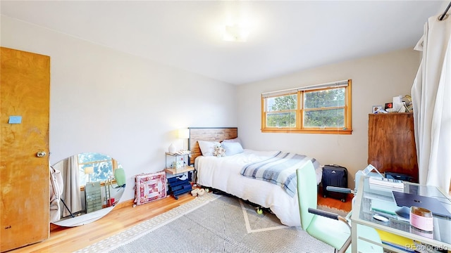 bedroom with wood finished floors