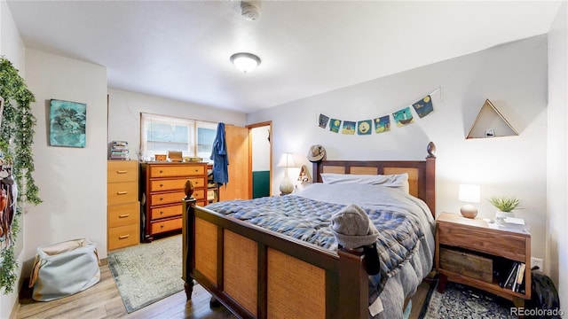 bedroom with wood finished floors