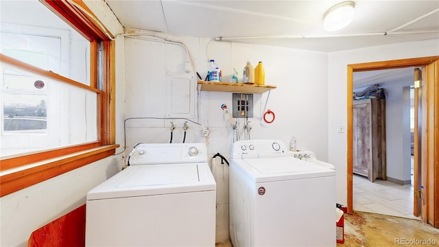 clothes washing area with laundry area and washer and clothes dryer