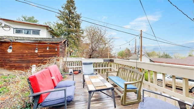 wooden deck featuring an outdoor hangout area