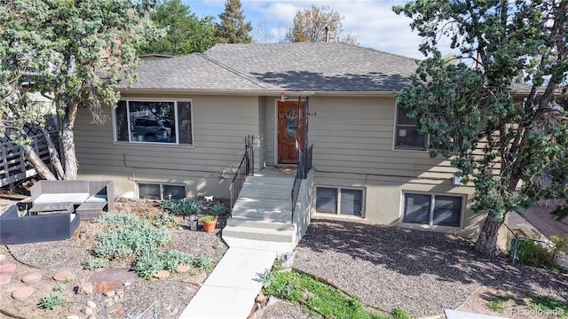 view of front of property featuring roof with shingles