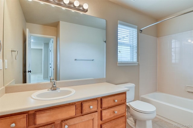 full bathroom featuring vanity, tile patterned floors, toilet, and bathtub / shower combination