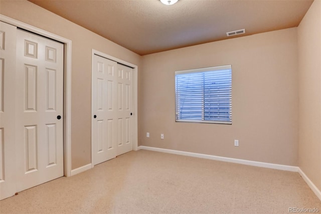 unfurnished bedroom featuring light colored carpet