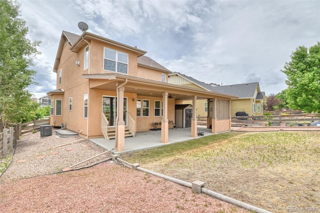 rear view of property featuring a patio area and central air condition unit