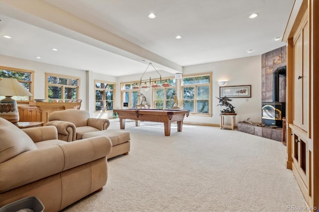 recreation room with pool table, carpet, and a wood stove