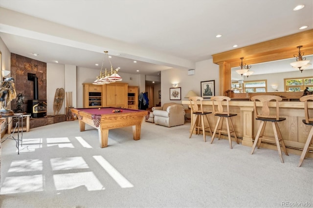 recreation room featuring light colored carpet, billiards, beamed ceiling, a wood stove, and bar