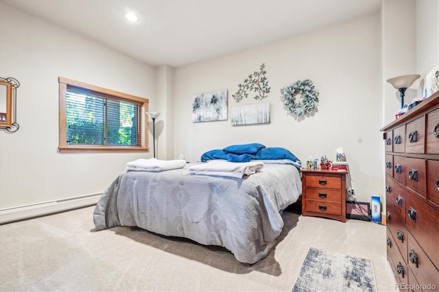 bedroom with light colored carpet and a baseboard radiator