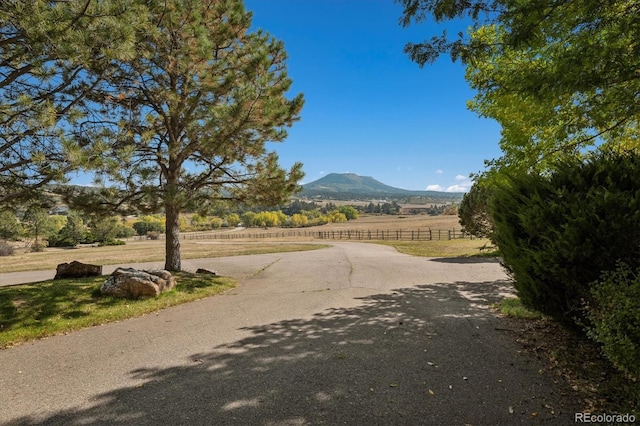 view of road with a mountain view and a rural view