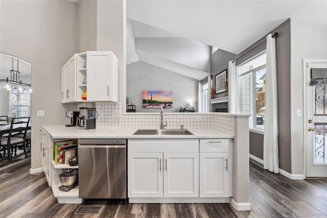 kitchen featuring white cabinetry, dishwasher, sink, dark hardwood / wood-style flooring, and lofted ceiling