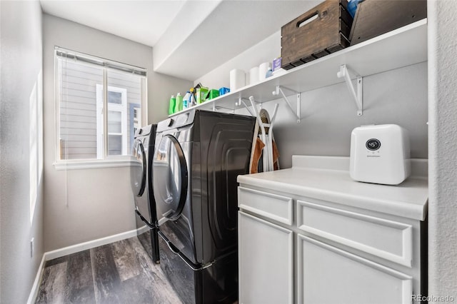 laundry area with separate washer and dryer and dark wood-type flooring