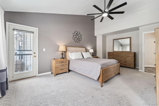 carpeted bedroom with ceiling fan, lofted ceiling, and access to outside