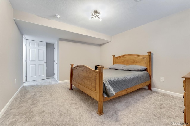 bedroom featuring light carpet