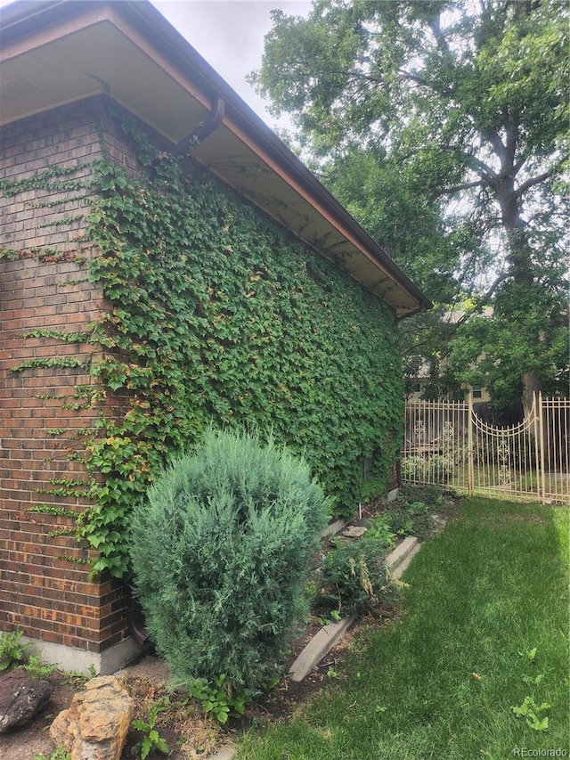 view of side of home featuring a yard