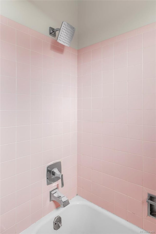 bathroom with shower / bath combination