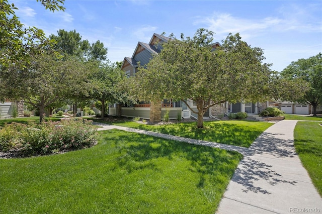 12812 Jasmine St Unit C, Thornton, CO 80602 - view of property hidden behind natural elements with a front lawn