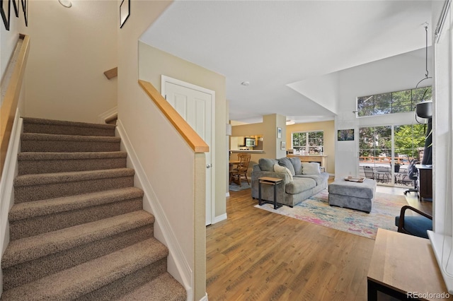 12812 Jasmine St Unit C, Thornton, CO 80602 - stairway with wood finished floors and baseboards