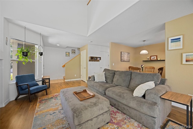 12812 Jasmine St Unit C, Thornton, CO 80602 - living room with wood finished floors, stairway, and recessed lighting
