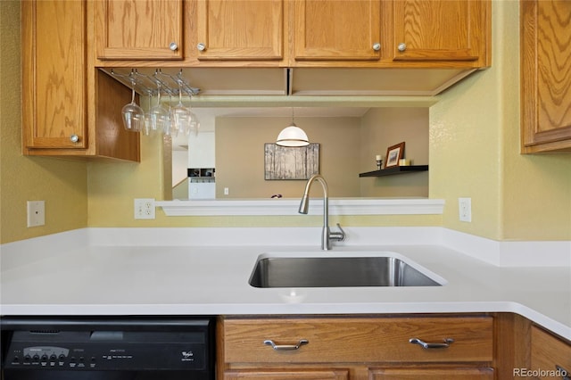 12812 Jasmine St Unit C, Thornton, CO 80602 - kitchen with black dishwasher, light countertops, and brown cabinetry