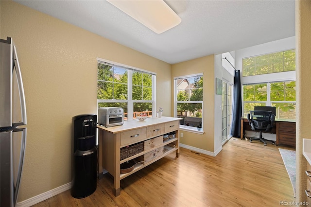 12812 Jasmine St Unit C, Thornton, CO 80602 - home office with light wood-type flooring and baseboards