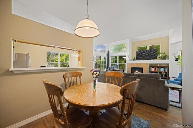 12812 Jasmine St Unit C, Thornton, CO 80602 - dining room with wood finished floors and a fireplace