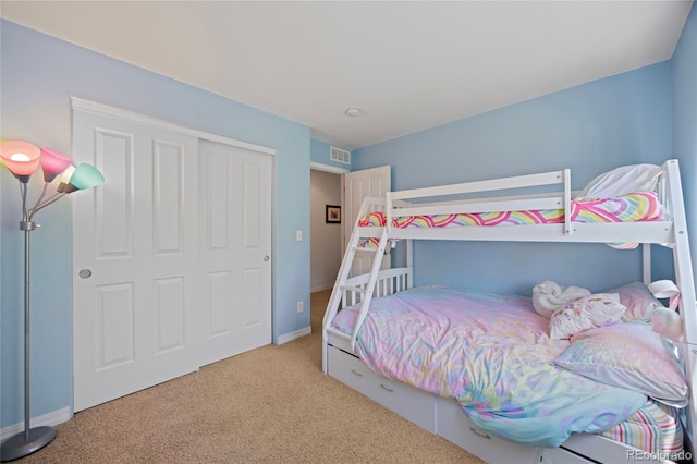 12812 Jasmine St Unit C, Thornton, CO 80602 - carpeted bedroom featuring a closet and baseboards