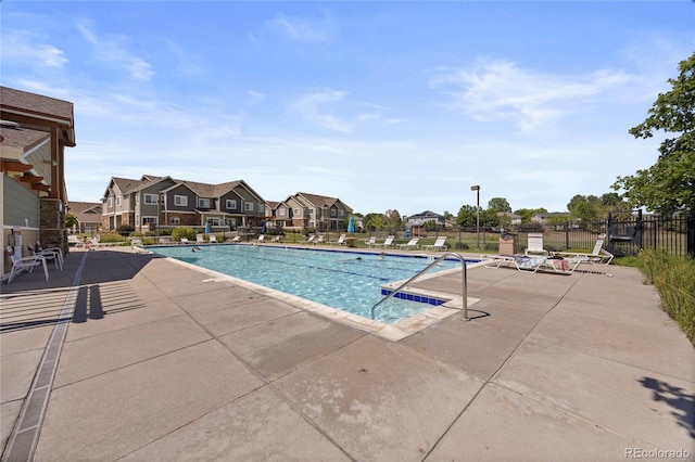 12812 Jasmine St Unit C, Thornton, CO 80602 - community pool with a patio and a residential view