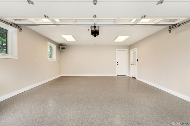 garage featuring a garage door opener and an AC wall unit