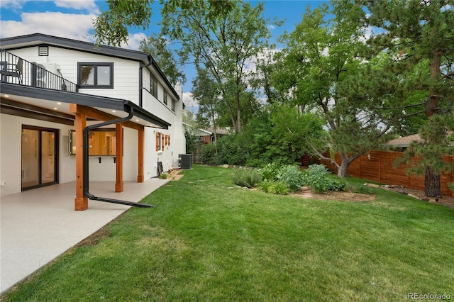 view of yard with a balcony, cooling unit, and a patio