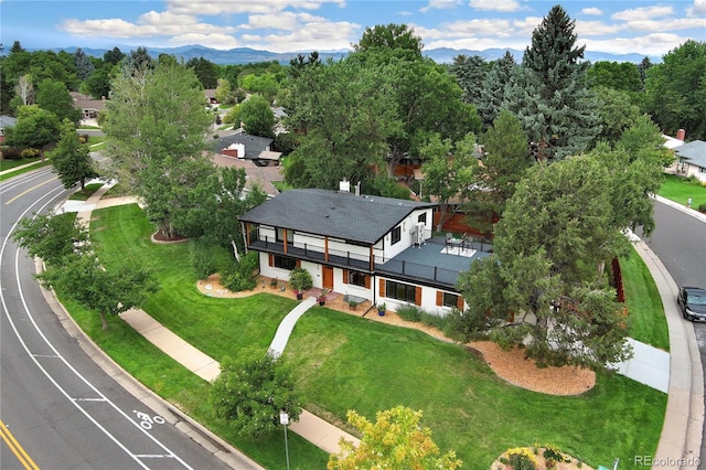 birds eye view of property featuring a mountain view