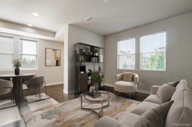 16069 E Elk Dr, Denver, CO 80239 - living room featuring healthy amount of natural light, wood finished floors, and recessed lighting