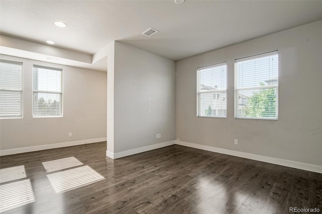 16069 E Elk Dr, Denver, CO 80239 - unfurnished room featuring healthy amount of natural light, dark wood-style floors, and recessed lighting