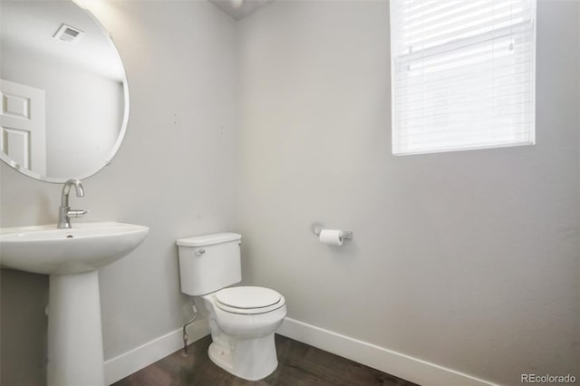 16069 E Elk Dr, Denver, CO 80239 - bathroom with toilet and wood finished floors