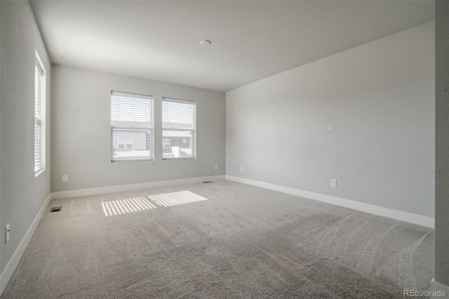 16069 E Elk Dr, Denver, CO 80239 - empty room featuring plenty of natural light and carpet floors