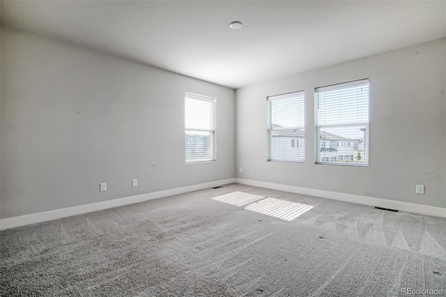 16069 E Elk Dr, Denver, CO 80239 - unfurnished room with baseboards and carpet flooring