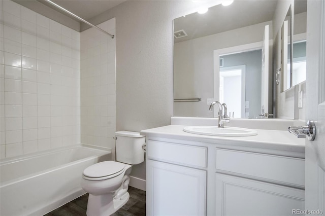 16069 E Elk Dr, Denver, CO 80239 - bathroom featuring vanity, shower / tub combination, a textured wall, and wood finished floors