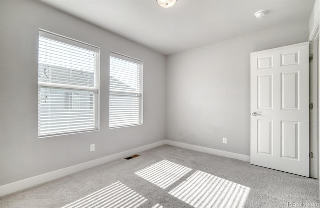 16069 E Elk Dr, Denver, CO 80239 - unfurnished room featuring carpet flooring and a smoke detector