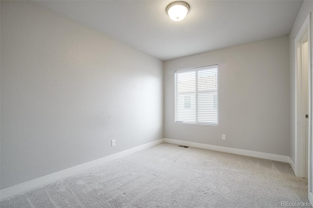 16069 E Elk Dr, Denver, CO 80239 - unfurnished room with light carpet and baseboards