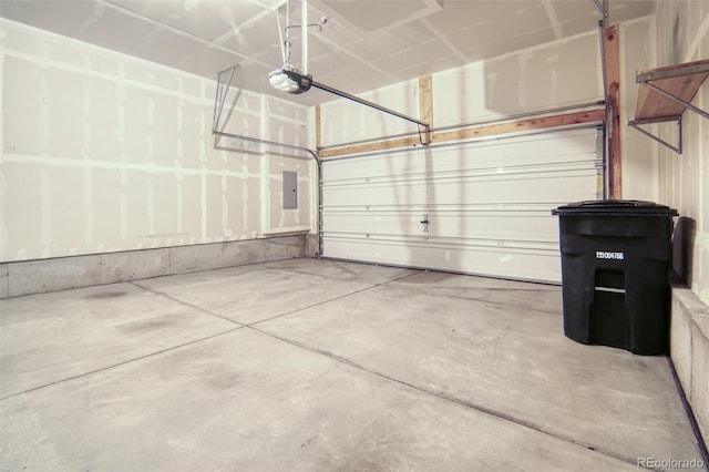 16069 E Elk Dr, Denver, CO 80239 - garage featuring a garage door opener and electric panel