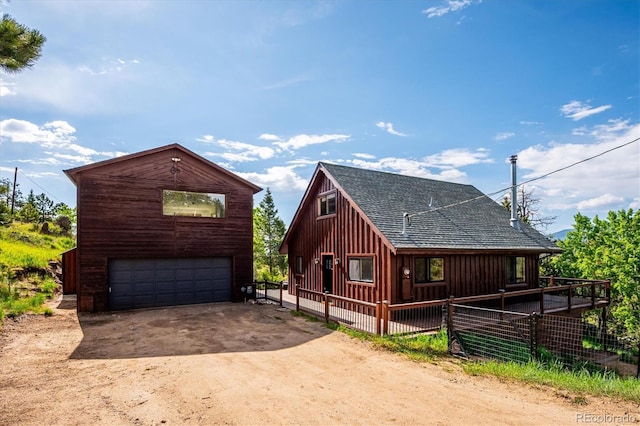 429 Overlook Dr, Bailey, CO 80421 - view of front of house with a detached garage and roof with shingles