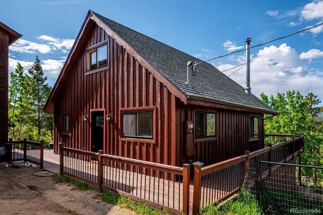 429 Overlook Dr, Bailey, CO 80421 - view of front of home featuring a shingled roof, a deck, and board and batten siding