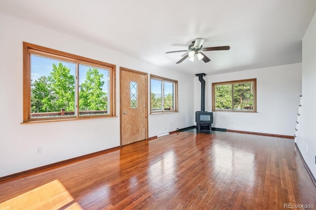 429 Overlook Dr, Bailey, CO 80421 - entrance foyer featuring a wood stove, a ceiling fan, and wood finished floors